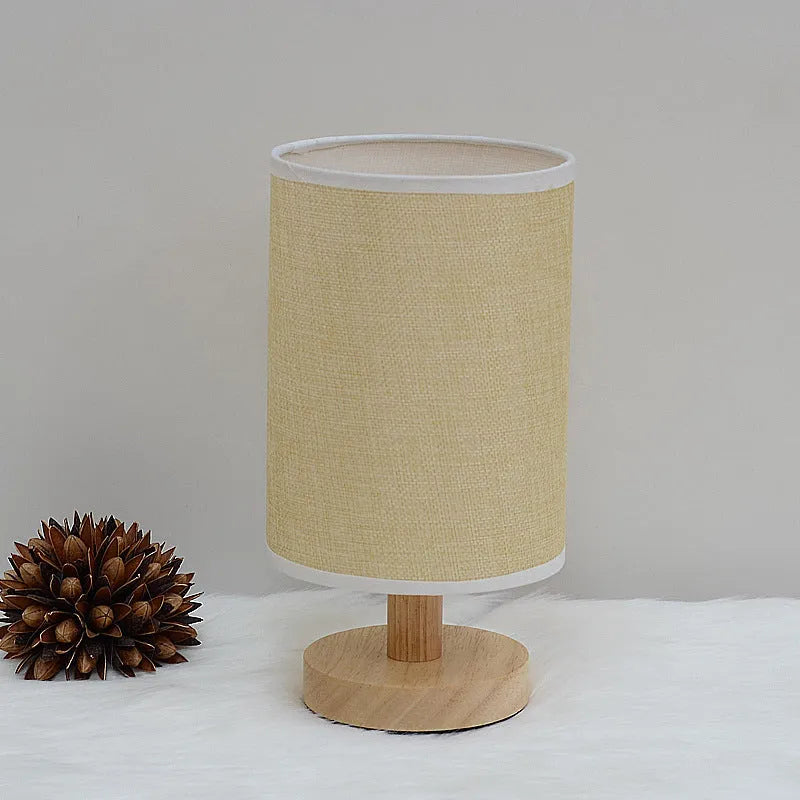 Wooden cloth cover table lamp with solid wood shade, LED light, push button switch, and USB outlet in grey linen or yellow jute.