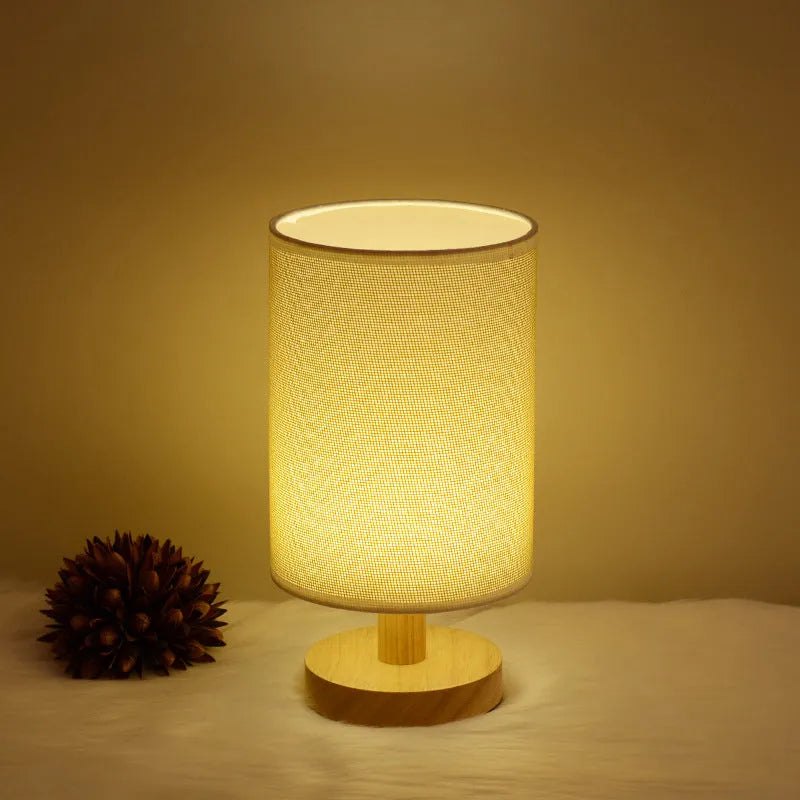 Wooden cloth cover table lamp with solid wood shade, LED light, push button switch, and USB outlet in grey linen or yellow jute.