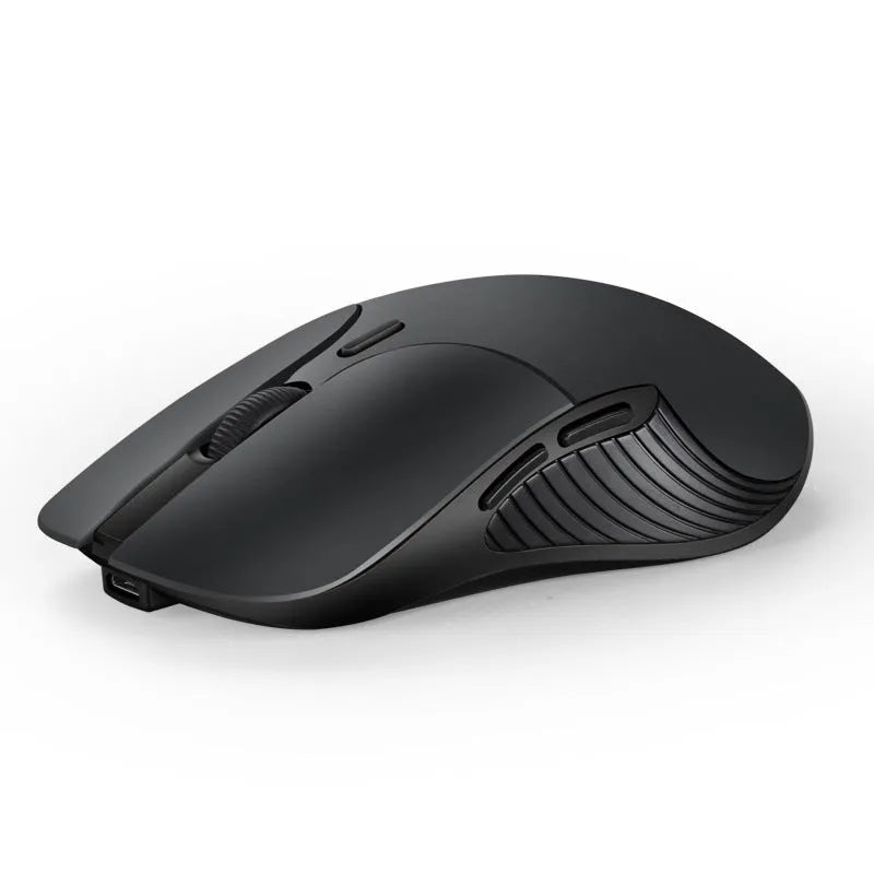 Blue Smart Voice Mouse with translation button on a desk next to a laptop.