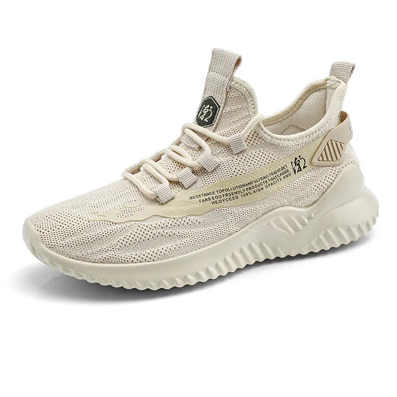 Men's white low-top sports shoes with mesh upper and rubber sole on a plain background.