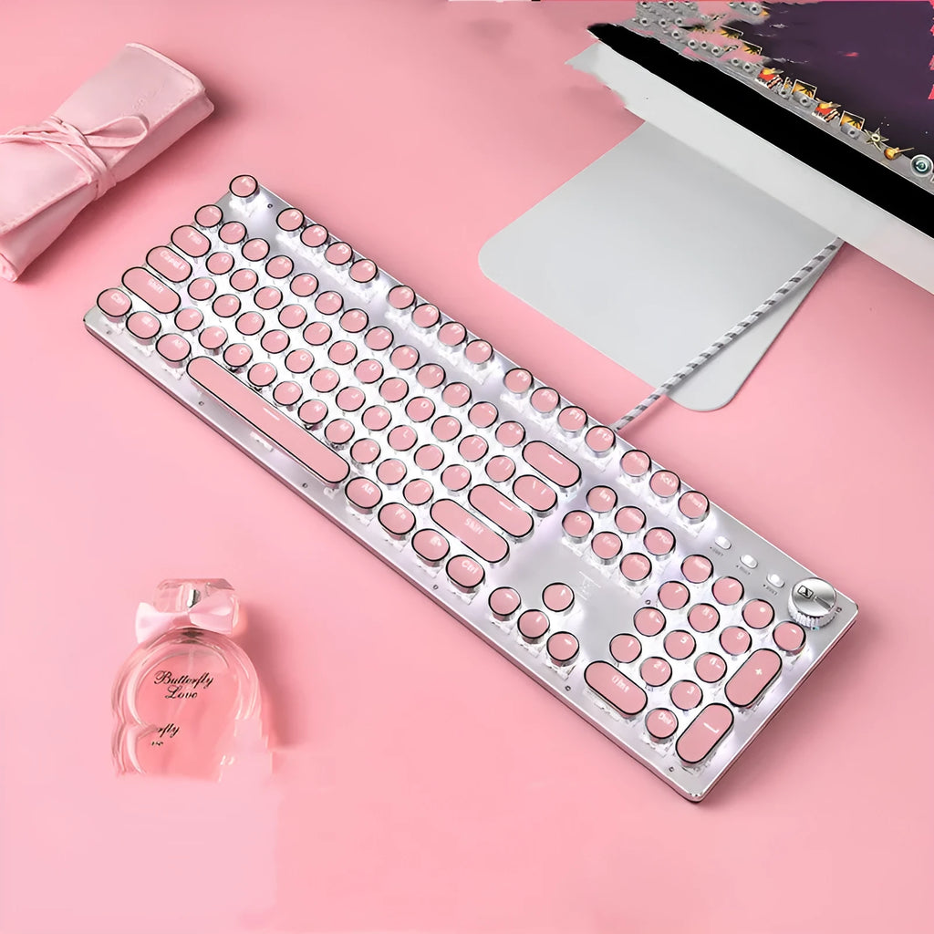 Silver and pink wired mechanical keyboard with green switches and white backlighting next to a matching mouse.