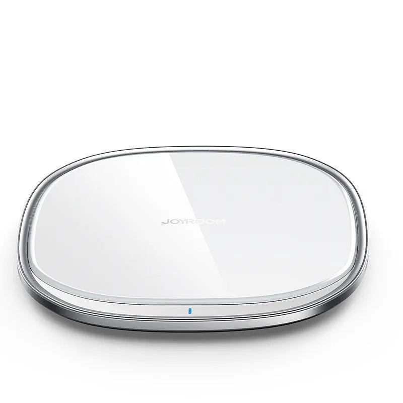 Black or white 15W wireless charging pad with zinc alloy and glass construction on a desk.