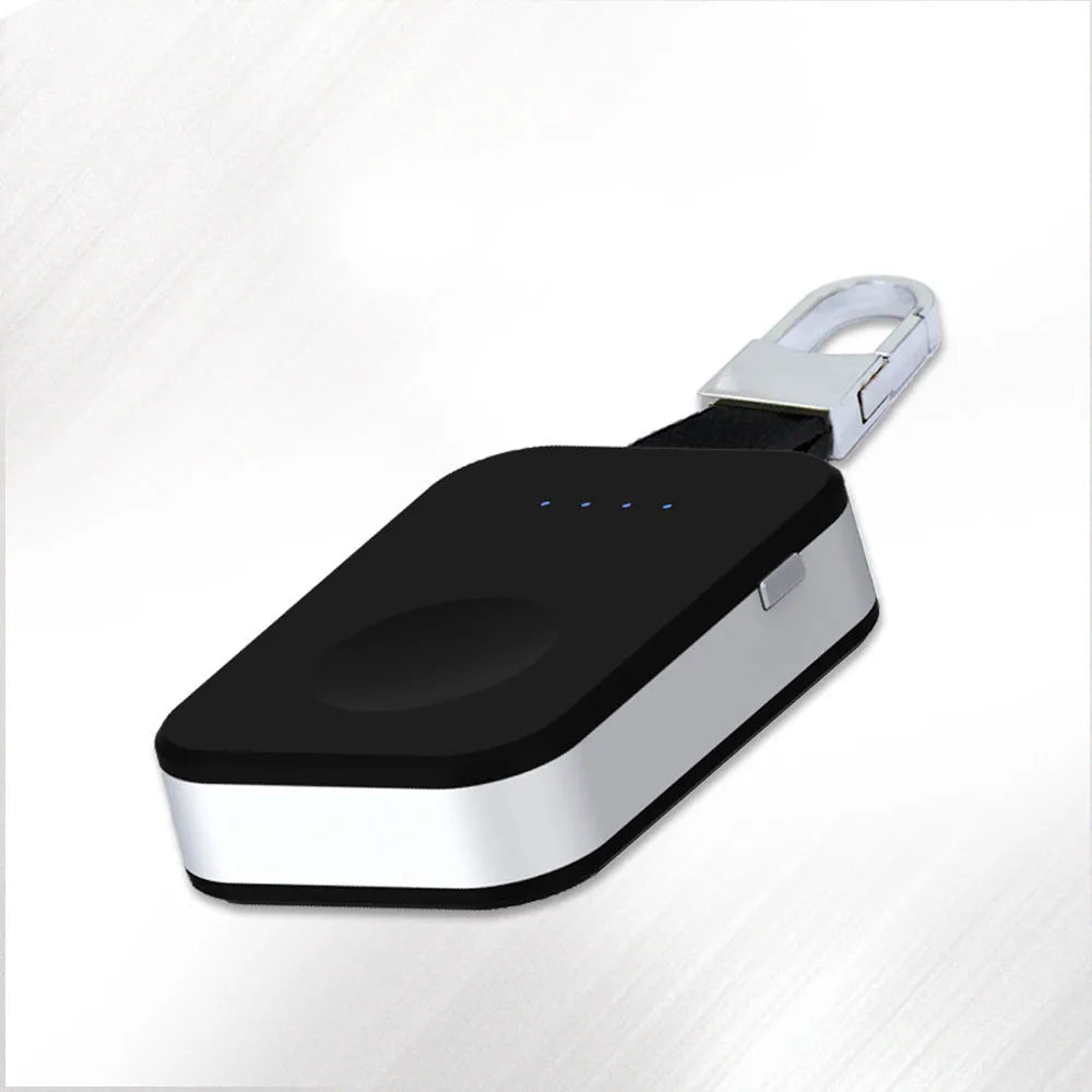 Black portable keychain power bank for wireless charging of an Apple Watch.