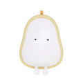PEAR warm yellow silicone bedside night light with ABS base on a table.