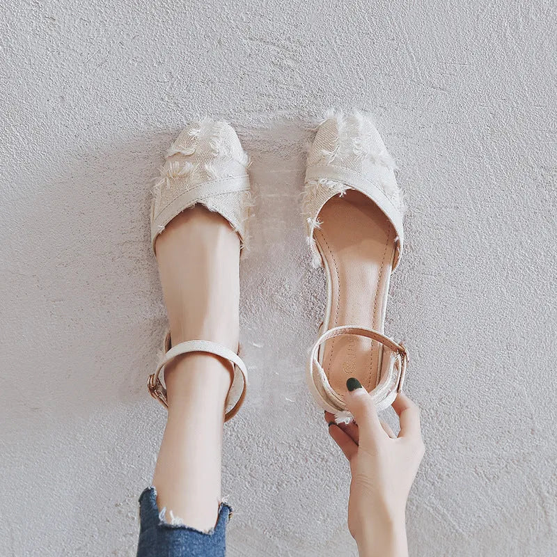 Women's apricot suede d'Orsay flats with an ankle strap and a low block heel.