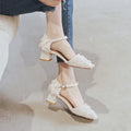 Women's apricot suede d'Orsay flats with an ankle strap and a low block heel.
