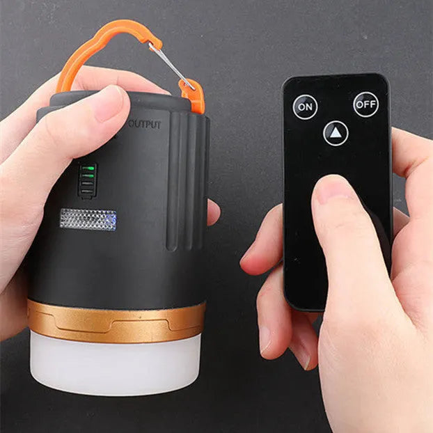 Black remote control emergency camping light with LED bulb for outdoor use.