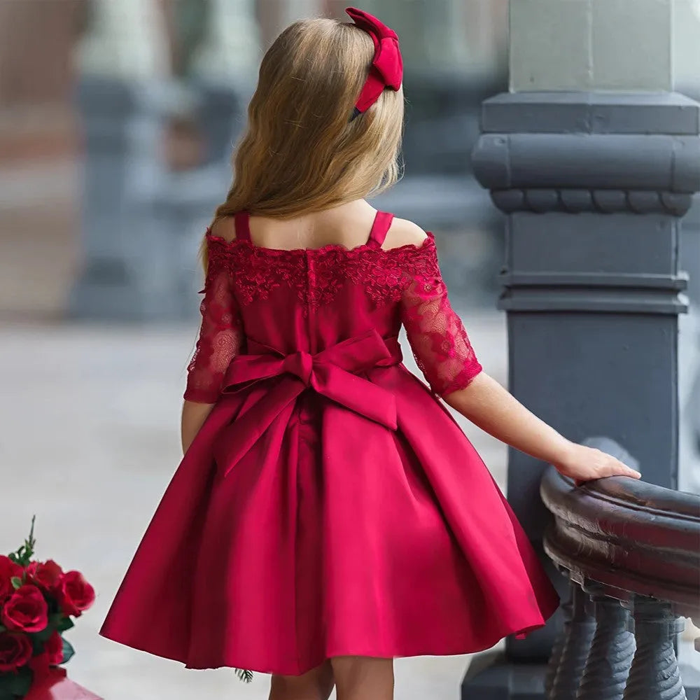 Simple lace-trimmed children's dress in deep red, available in toddler and child sizes.