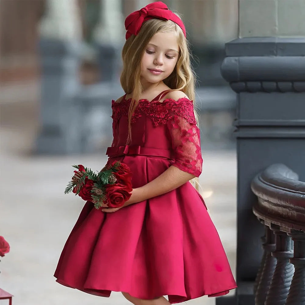 Simple lace-trimmed children's dress in deep red, available in toddler and child sizes.