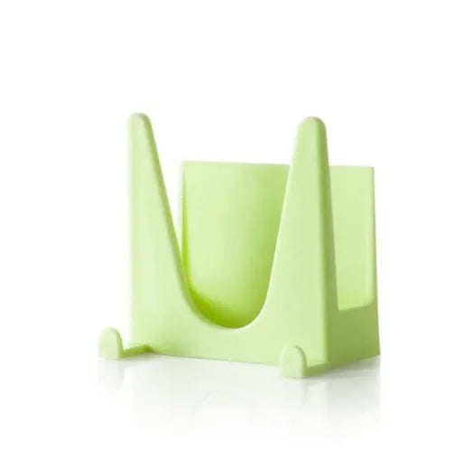 Wall-mounted PP plastic kitchen lid holder in blue, green or white, stuck inside a cabinet for lids and utensils.