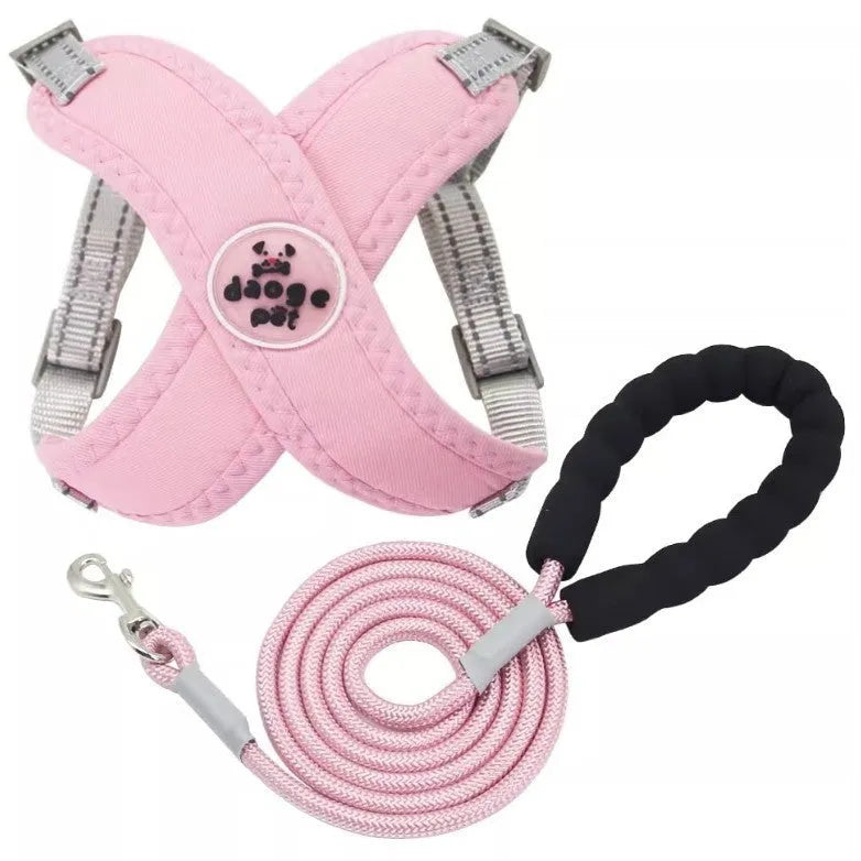 Polyester dog vest and hand holding leash set in blue, green, pink, or yellow.
