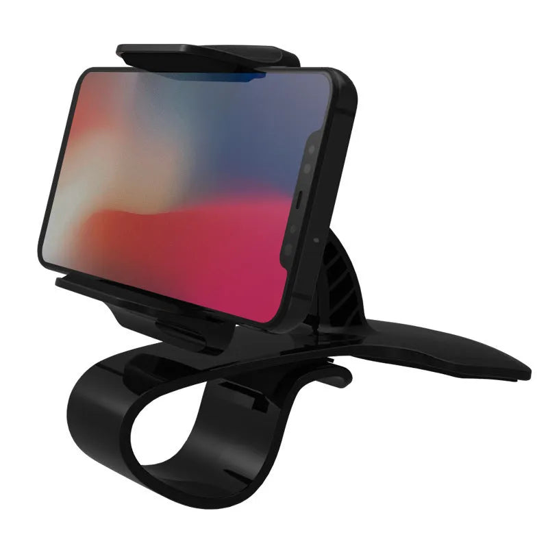 Black dashboard car phone holder mounted on a car dashboard edge, holding a smartphone.