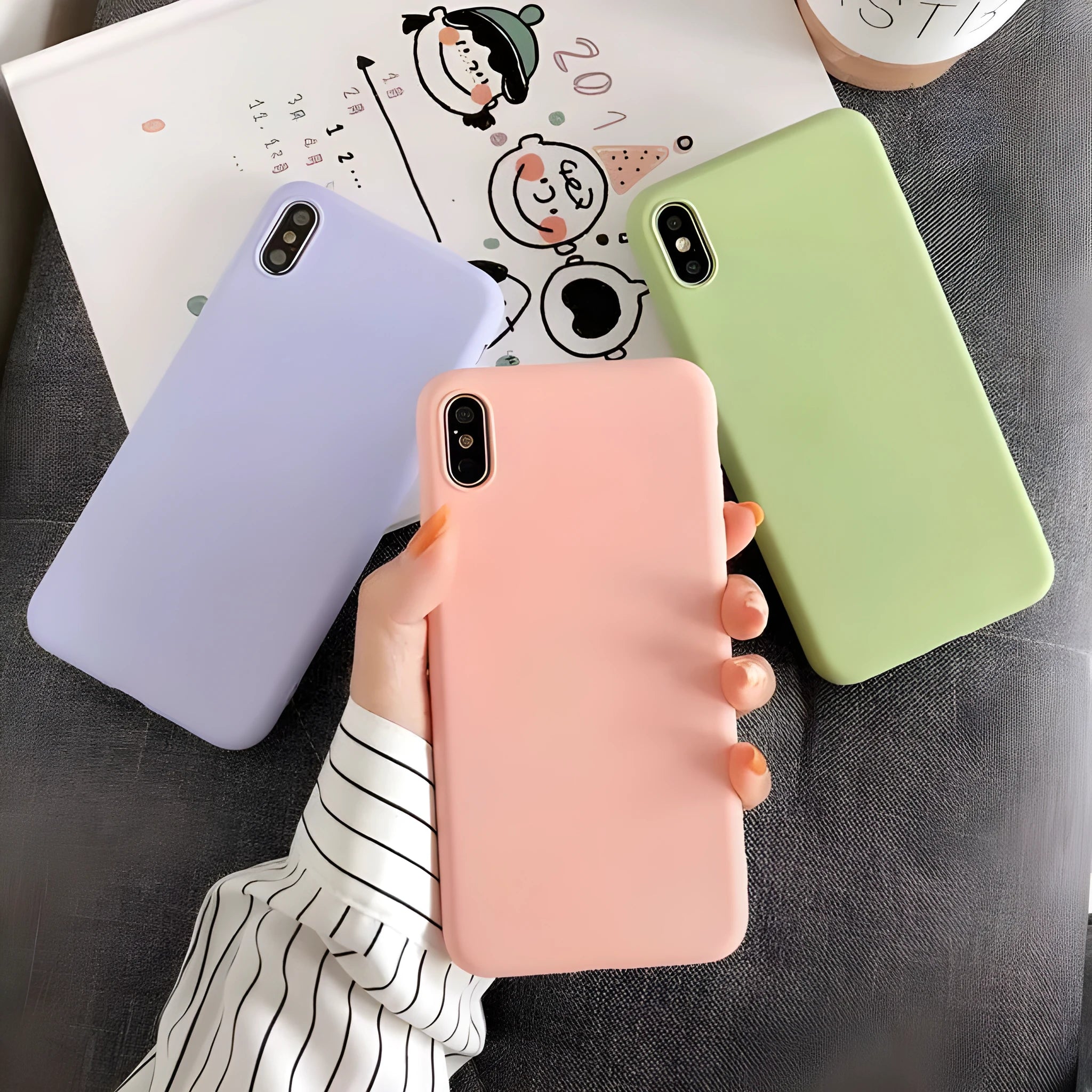 Silicone back cover case for Apple iPhone in solid colours including black, blue, pink, and red.