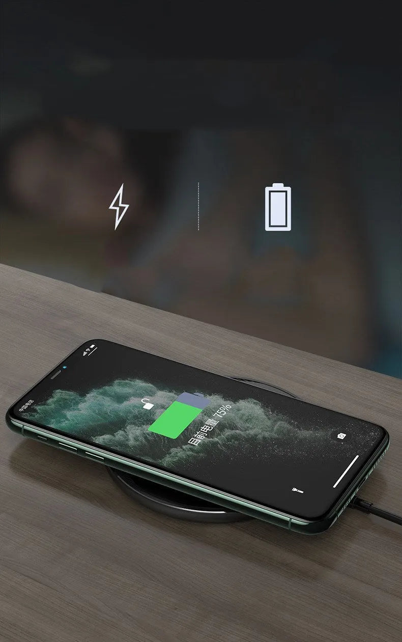 Black Kuulaa KL-CD16 wireless disc phone charger on a surface with LED light on.