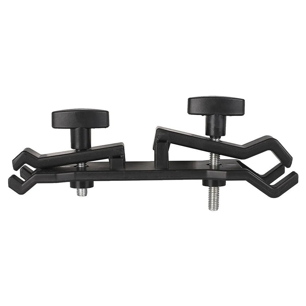 Black ABS plastic umbrella clip for attaching a brolly to a camera tripod.