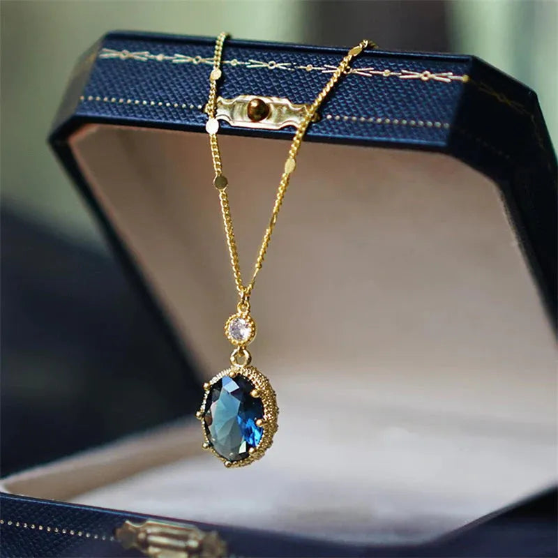 Gold colour geometric pendant on a chain, French retro necklace design