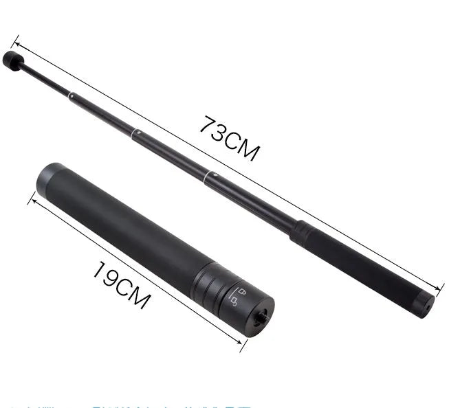 Black retractable aluminium selfie stick extended to full length with a smartphone attached in the clamp.