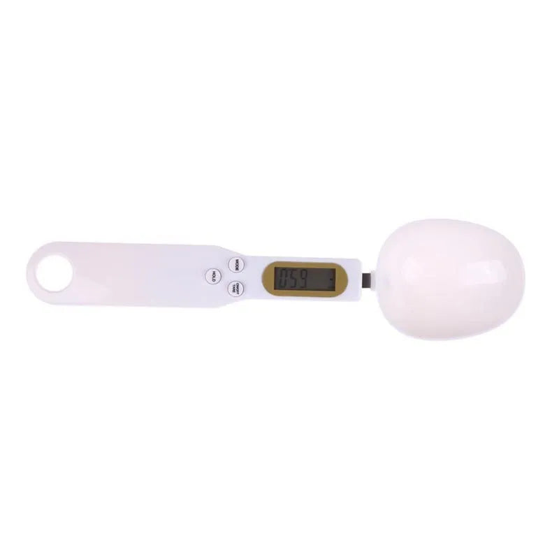 White digital spoon scale with LCD display showing weight measurement for kitchen use