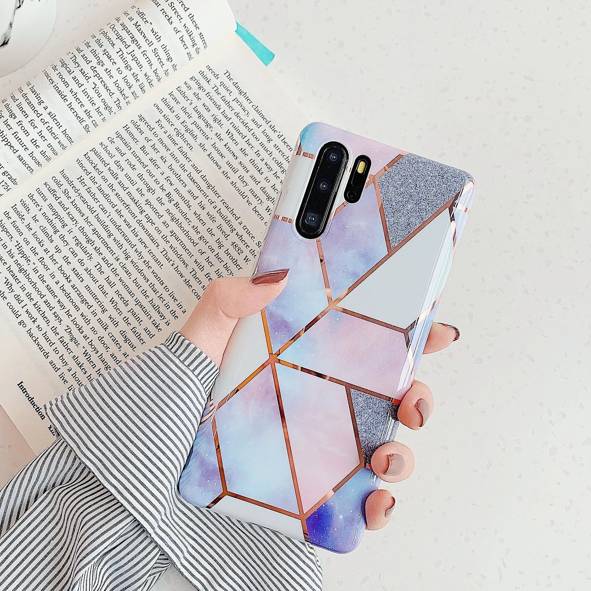 Electroplated marble patterned phone back cover case for Huawei and Samsung smartphones.