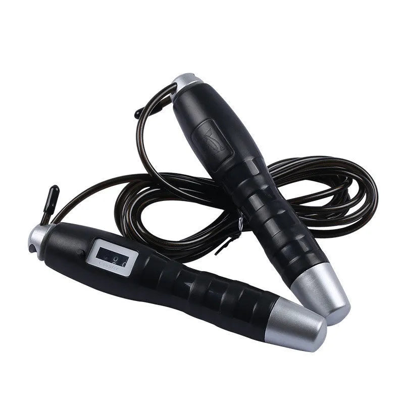 Adjustable digital skipping rope with ABS handles and TPU coated steel cable in black and pink for fitness exercise.