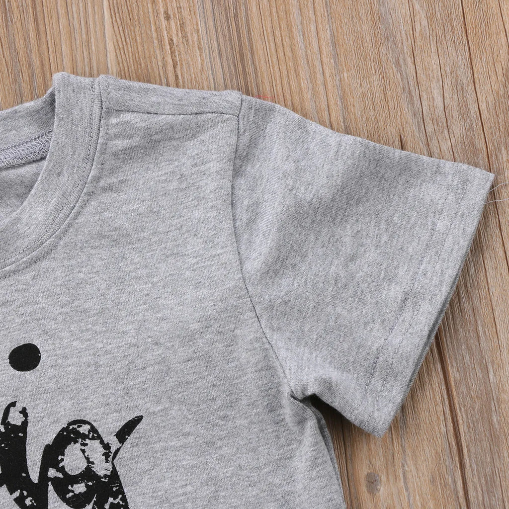 Grey kids cotton t-shirt with printed brother sister designs showing size range from 60cm to 140cm