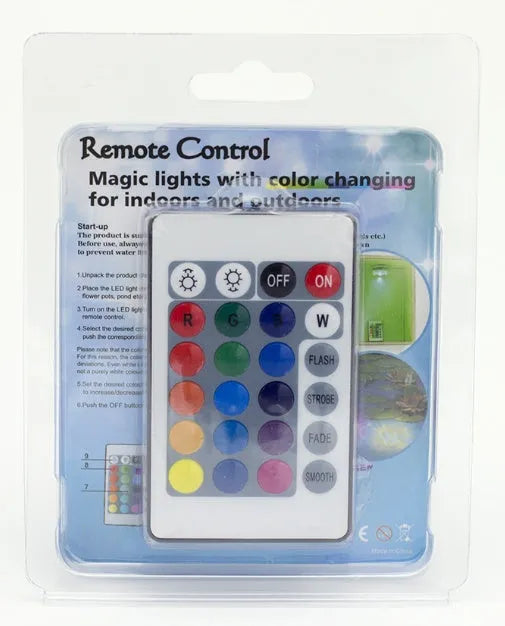 IP68 waterproof LED remote control diving light with 16 colour modes placed in a glass vase of water