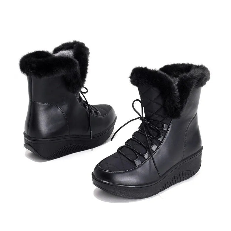 Black women's lace-up winter boots with 3cm platform sole on a neutral background