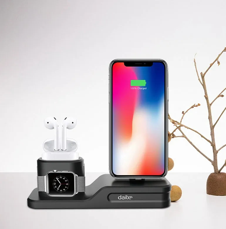 Black geometric 3-in-1 charging station for Apple devices showing iPhone, iwatch and AirPods charging slots