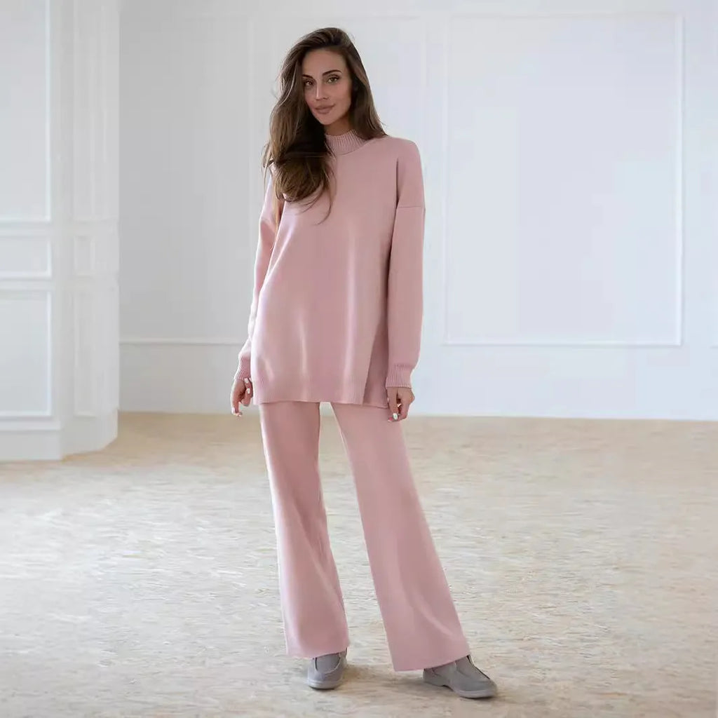 Women's turtleneck knit sweater suit set in solid colour with long sleeves and matching trousers on display