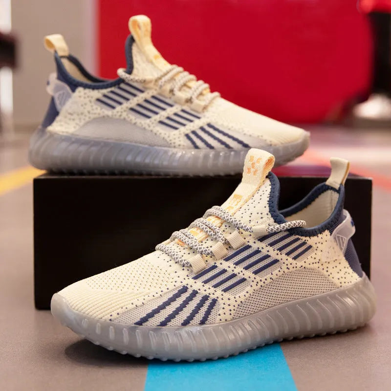 Men's white flying fabric breathable sneakers with mesh lining, round toe and low upper design on a neutral background.