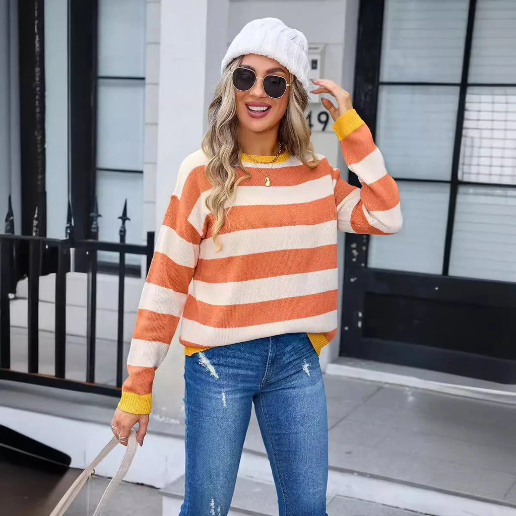 Women's loose fit long sleeve acrylic sweater in striped or plaid pattern