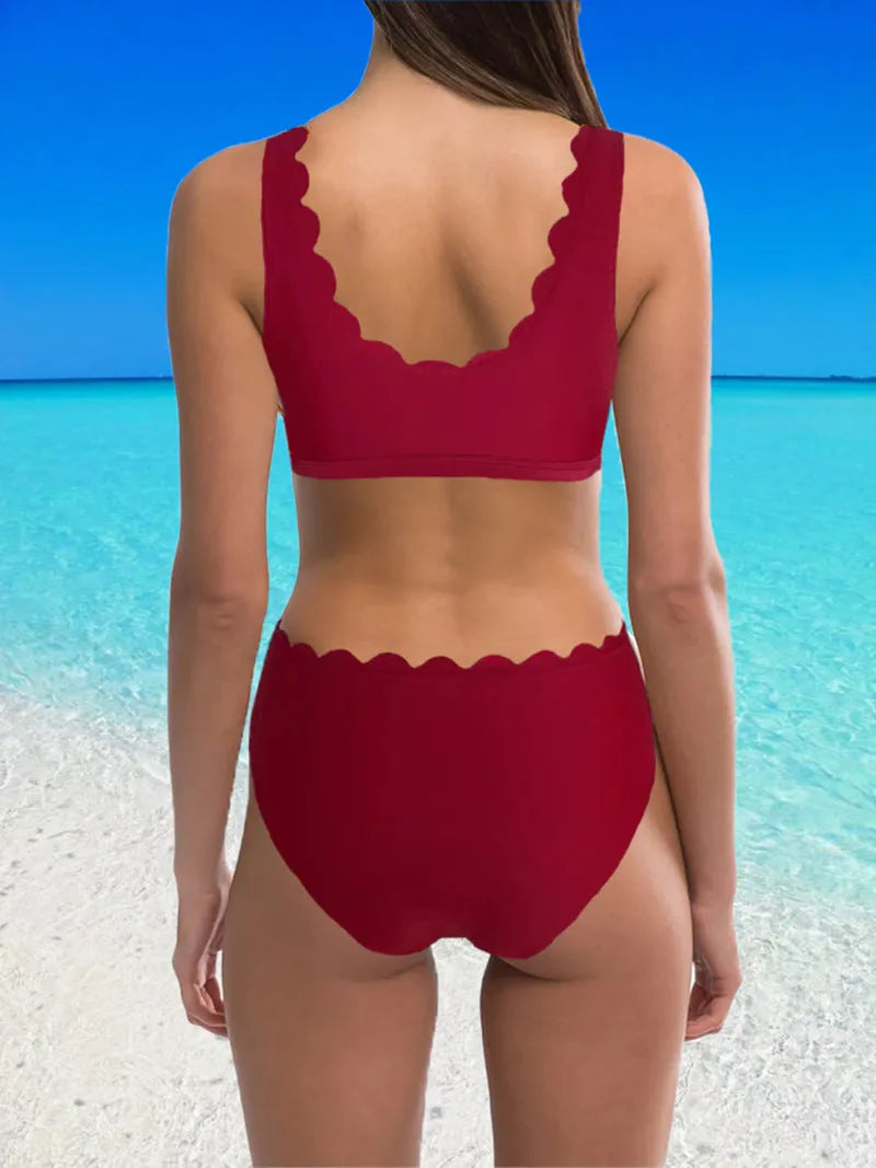 Women's solid colour polyester split swimsuit with gathering detail on a brief