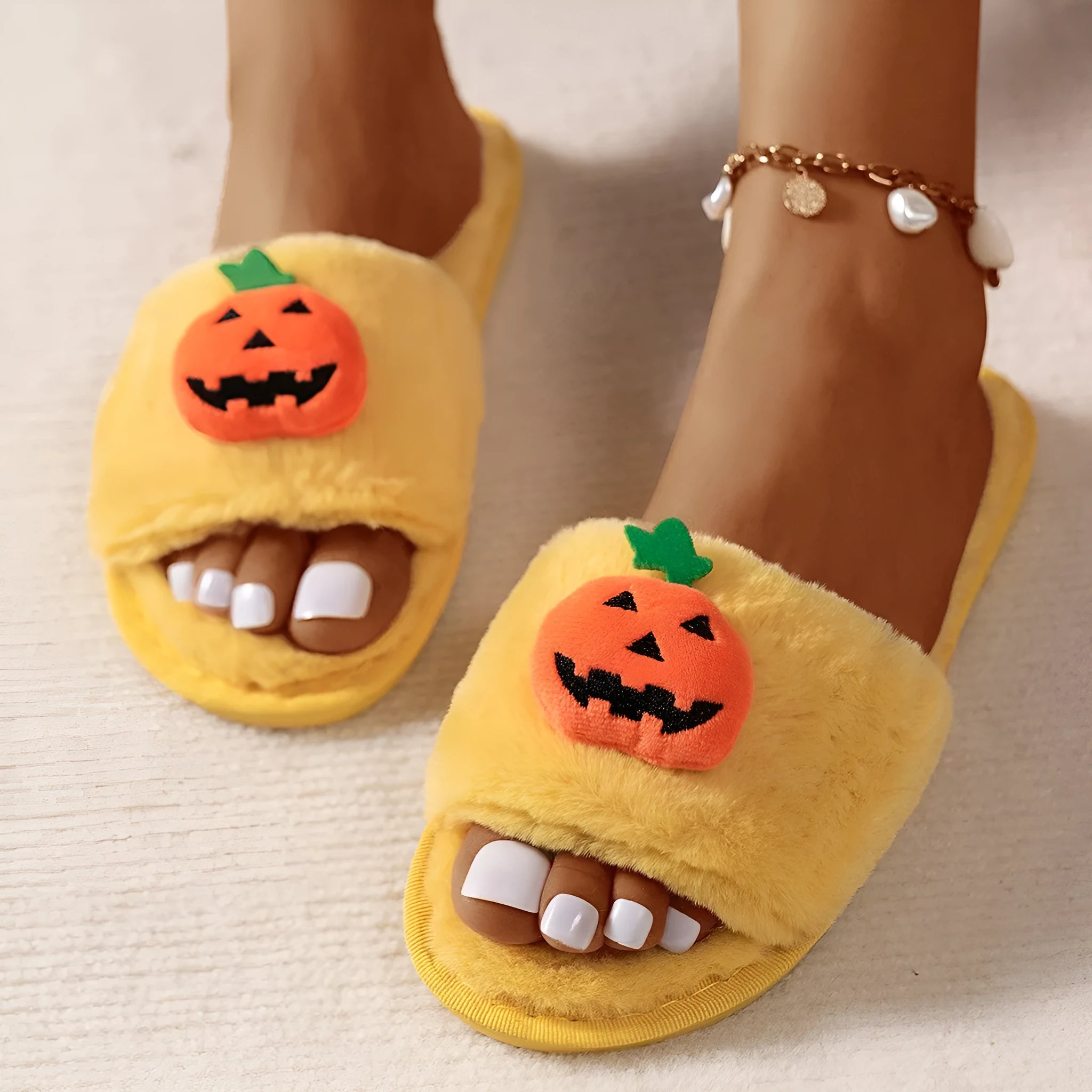 Pumpkin plush slippers with cartoon design, synthetic fur upper and PVC sole