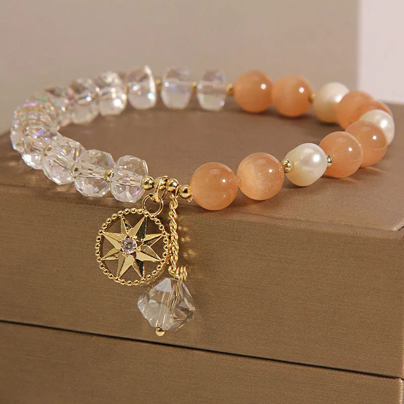 Orange women's bracelet with eight Awn star design and gold-plated inlaid stone.