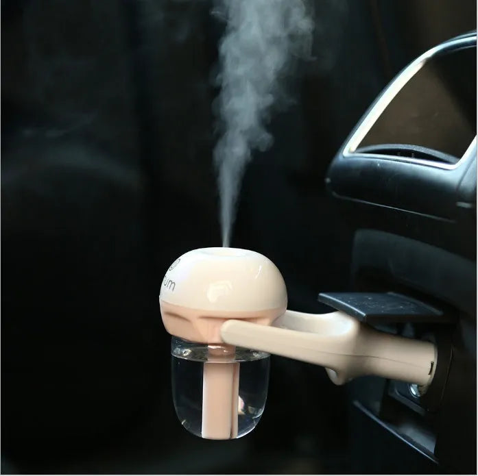 Portable car humidifier with essential oil diffuser function showing compact design for vehicle use