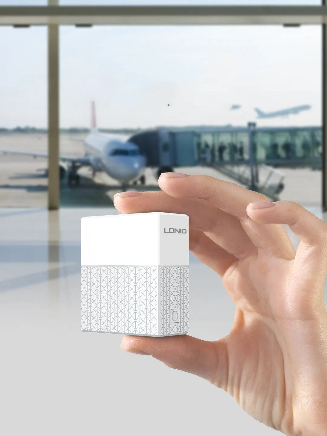 White two-in-one mobile power bank charger with built-in UK, EU, and US plug pins