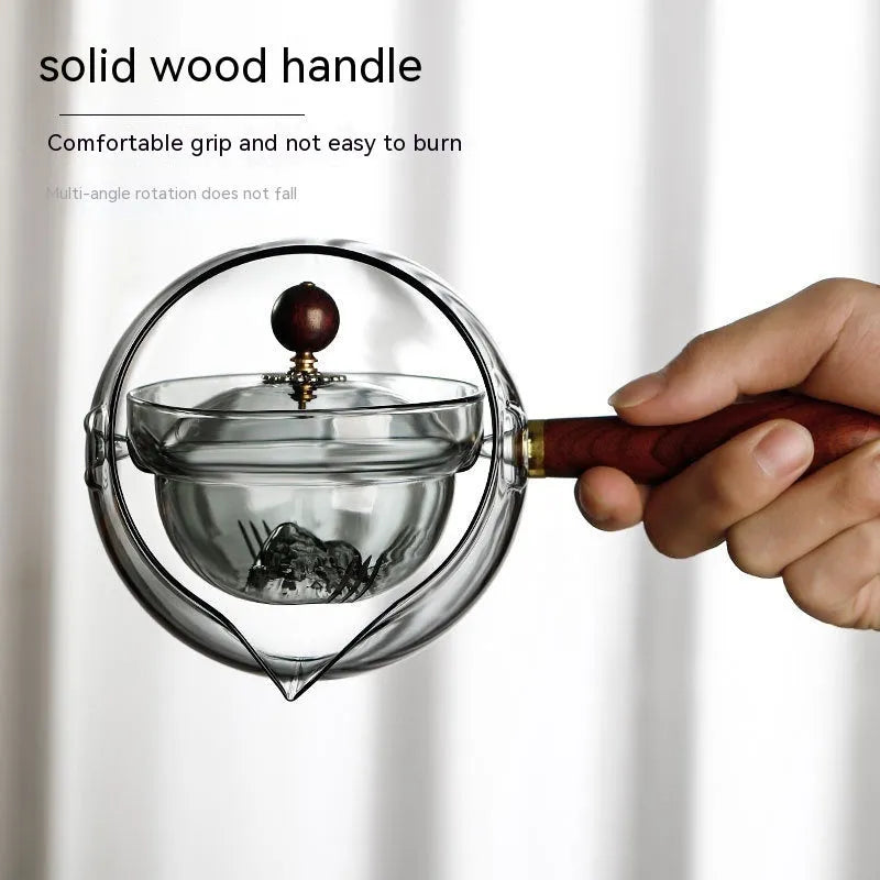 Transparent borosilicate glass teapot with wooden handle and removable infuser for rotary tea brewing