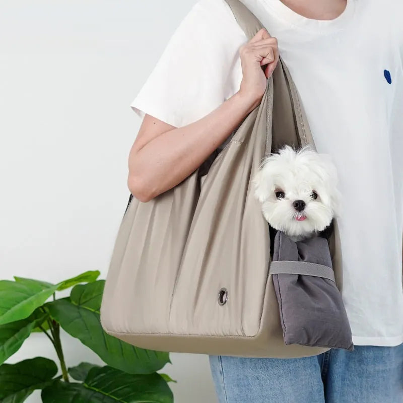 Apricot cloth pet carrier handbag for small dogs or cats, showing handle and breathable fabric.