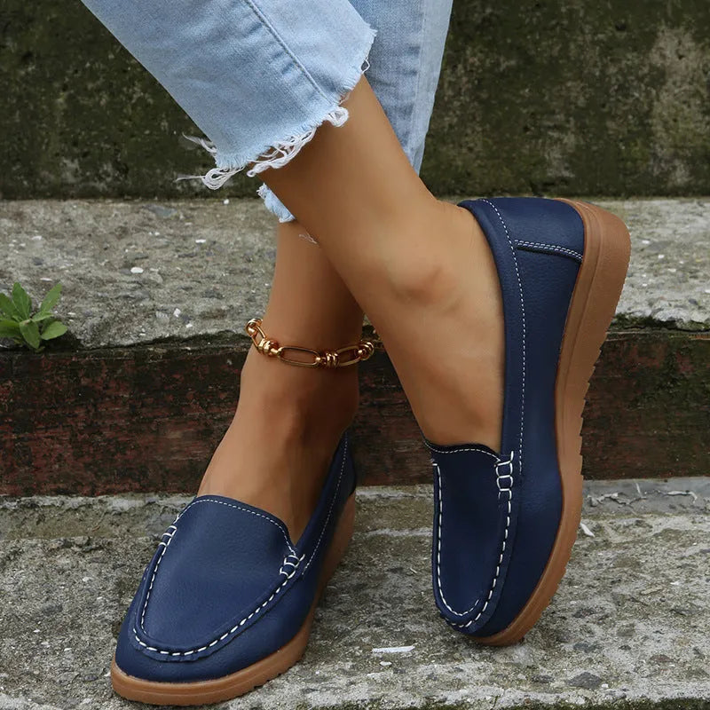Women's flat loafer shoe in PU leather with a round toe and rubber sole, shown in a colour option.