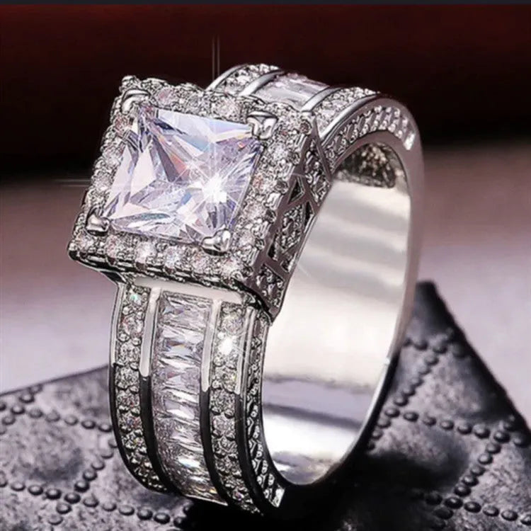 Geometric sweet and cool style alloy ring in gold or white electroplated finish.