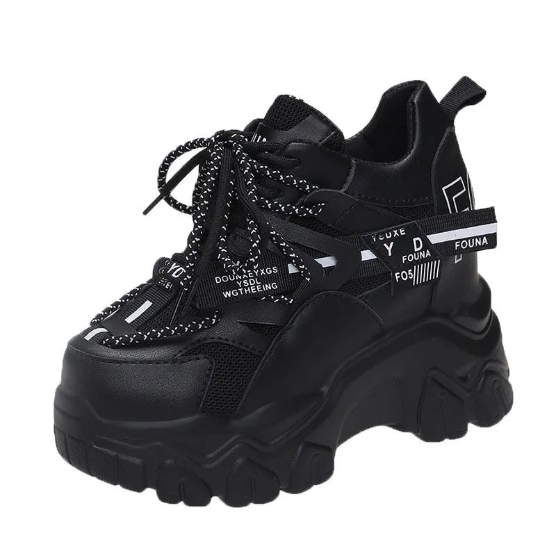 White women's low-top platform sports shoes with cross-strap and round toe on a rubber sole.
