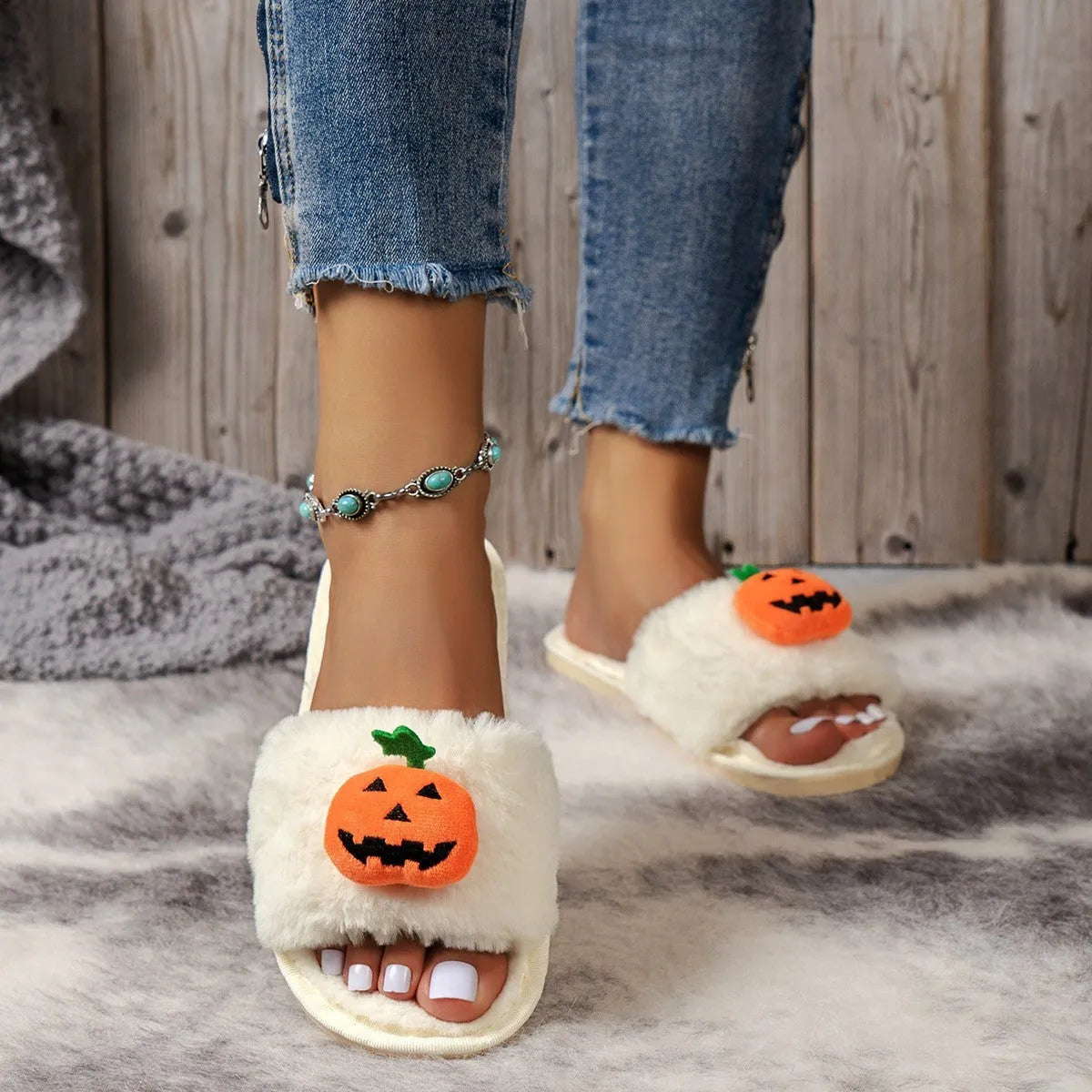 Pumpkin plush slippers with cartoon design, synthetic fur upper and PVC sole