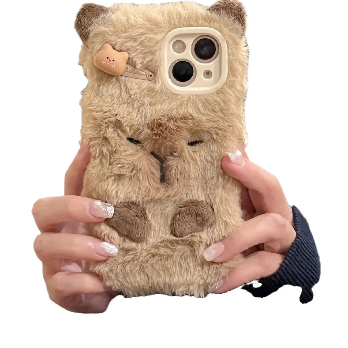 Brown furry plush capabala phone case for iPhone showing cartoon face and flannel texture