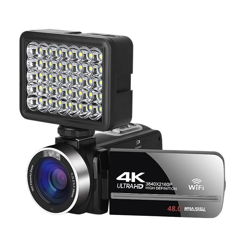 Black WIFI digital HD night vision camera with 3-inch screen showing menu, beside its included lens cover and remote control.