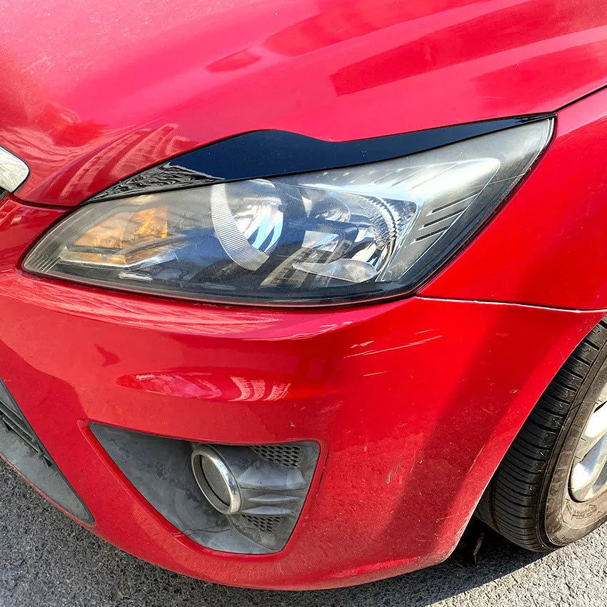 Ford Focus headlight eyebrow stickers in carbon fibre pattern and piano black ABS plastic