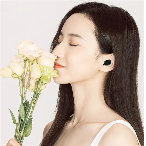 M1 wireless Bluetooth headset in black or white colours with bilateral earbud design