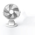 USB mini clip fan in green with clip base on wooden desk showing 135mm blade
