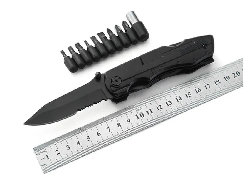 Black multi-purpose folding pliers tool with 7.5cm blade and aluminium handle on a flat surface