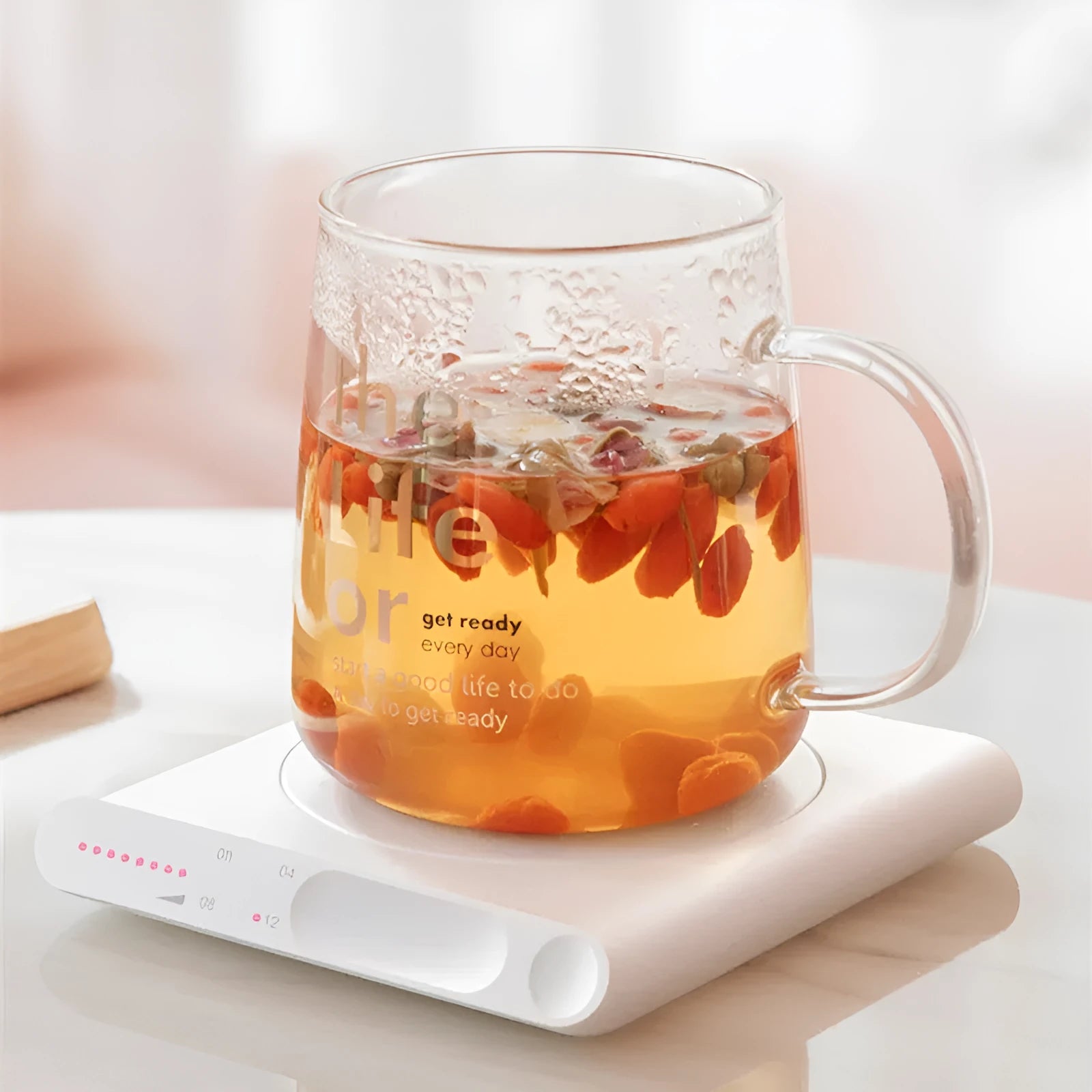 Pink and white USB-powered mechanical heating coaster for coffee mugs and teacups