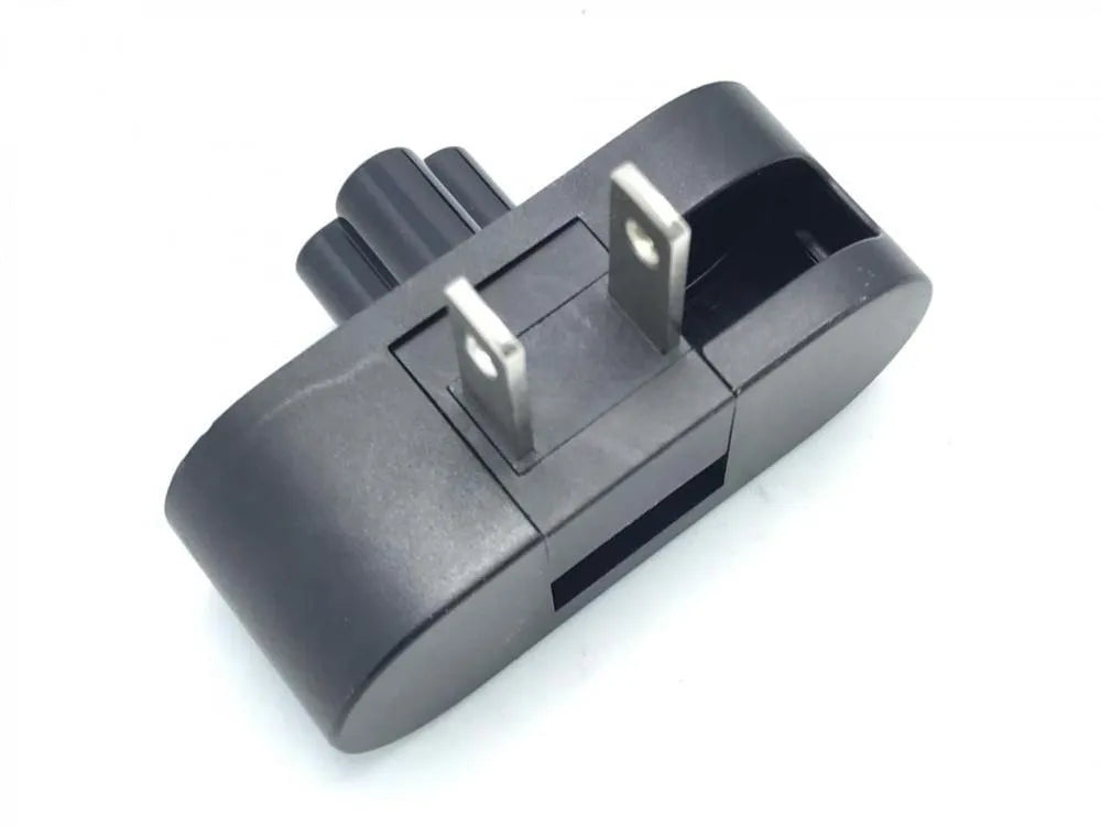 Black folding US plug travel adapter showing plug in both straight and folded positions